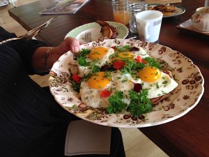 Easy over eggs on corn fritters. Photo by R.E.